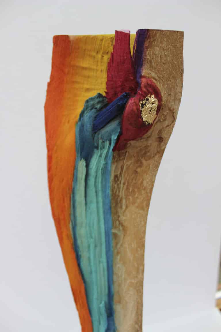 Objekt Aufbruch 	farbiges Holz auf Speckstein mit Blattgoldimitat	13x50  Privatbesitz